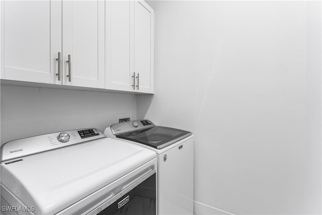 854 SW 15th Ave, Cape Coral, FL 33991 - washroom with washing machine and dryer and cabinet space