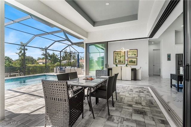 view of pool with a lanai and a patio