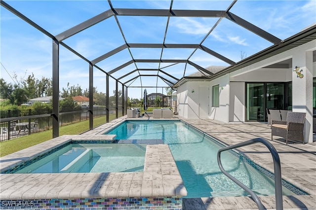 view of pool featuring an in ground hot tub, a patio area, and a lanai