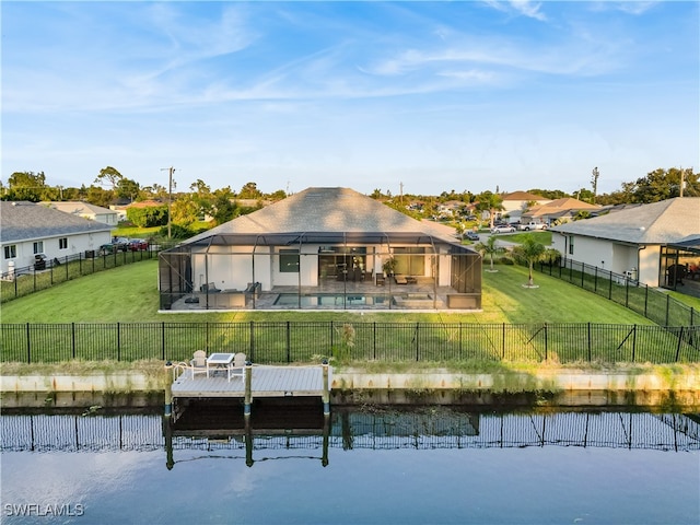 rear view of property with a swimming pool, a patio area, a yard, a gazebo, and a water view