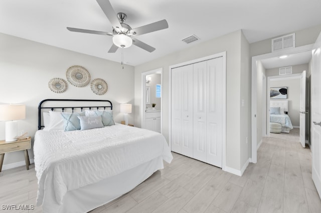 bedroom with ceiling fan, a closet, connected bathroom, and light hardwood / wood-style flooring