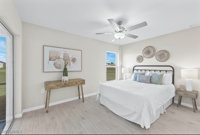 bedroom featuring ceiling fan and light hardwood / wood-style flooring