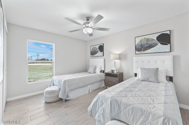 bedroom featuring ceiling fan and light wood-type flooring