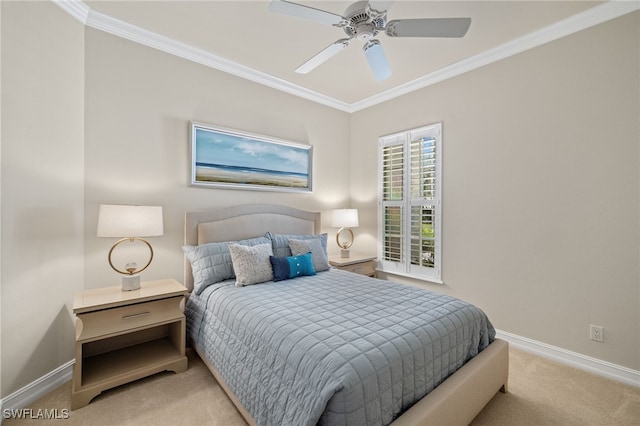 bedroom with crown molding, light colored carpet, and ceiling fan