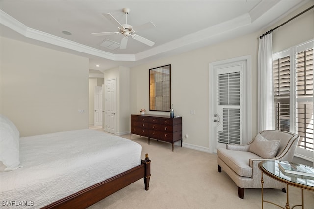 bedroom with light carpet, ornamental molding, a tray ceiling, and ceiling fan