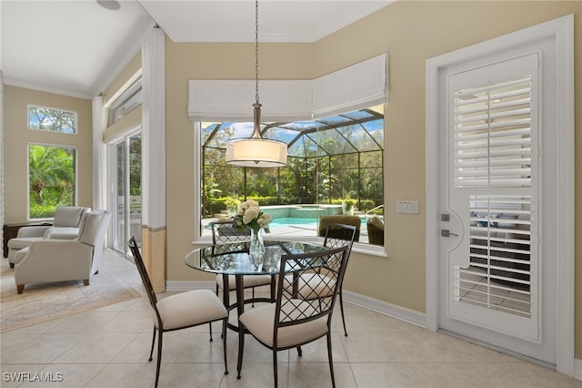 tiled dining room featuring ornamental molding