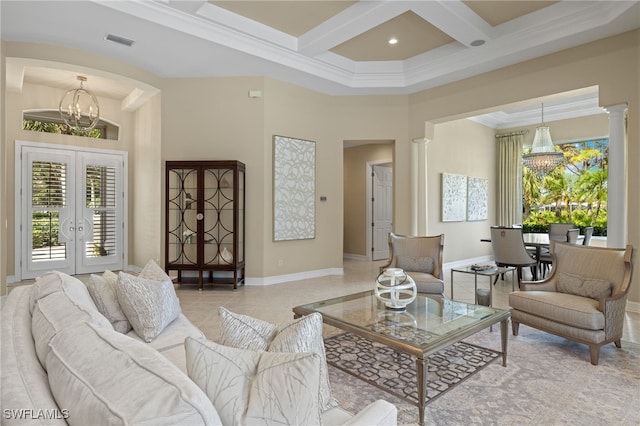 tiled living room with french doors, coffered ceiling, ornate columns, ornamental molding, and a chandelier