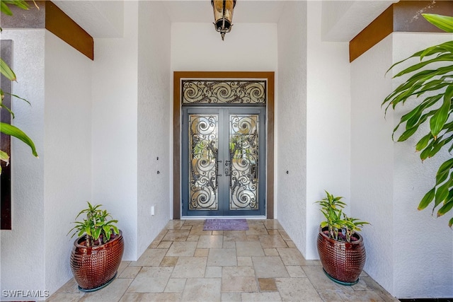 property entrance featuring french doors