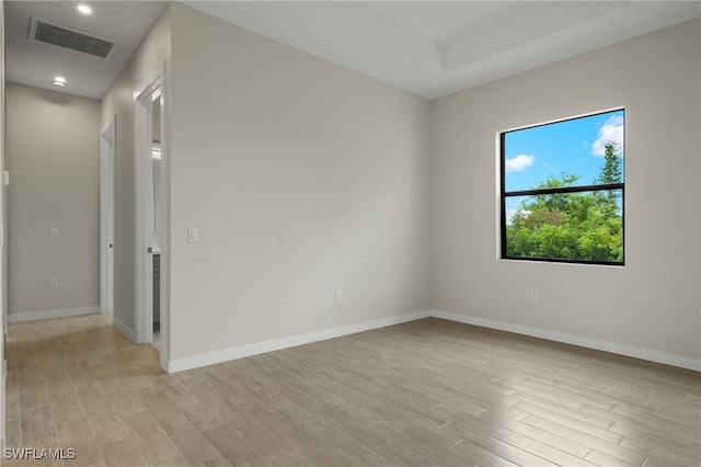 unfurnished room featuring recessed lighting, baseboards, visible vents, and light wood finished floors