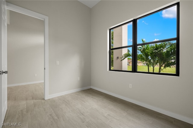 spare room with light hardwood / wood-style flooring