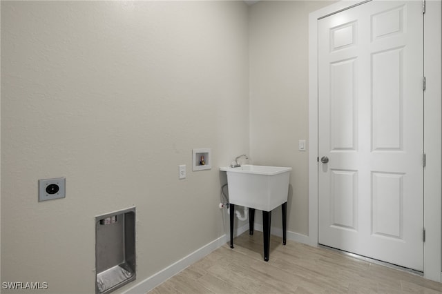 laundry room with laundry area, electric dryer hookup, baseboards, light wood finished floors, and hookup for a washing machine