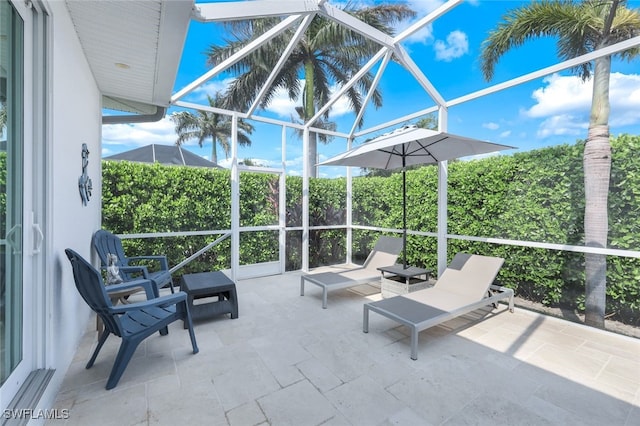 view of patio / terrace with a lanai