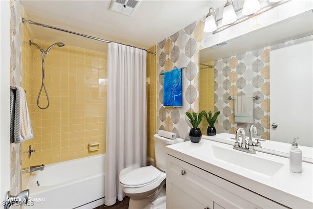 full bathroom with vanity, toilet, and shower / tub combo with curtain