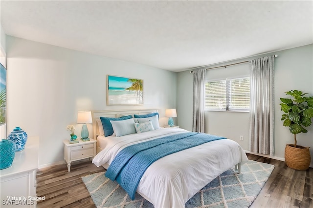 bedroom with hardwood / wood-style floors