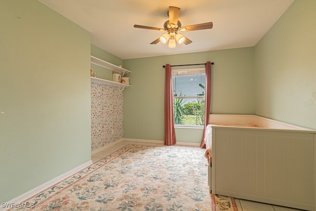 unfurnished bedroom featuring ceiling fan