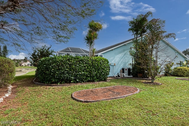 view of yard featuring a lanai