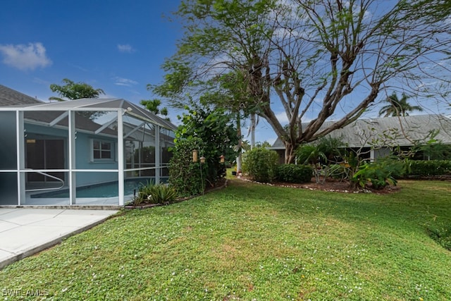 view of yard featuring glass enclosure