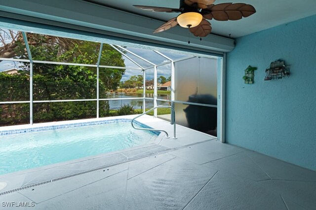 view of pool featuring a patio, ceiling fan, and a lanai