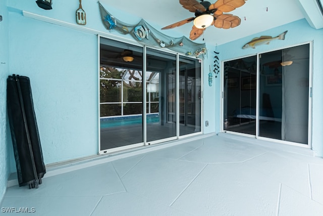 view of patio / terrace featuring ceiling fan