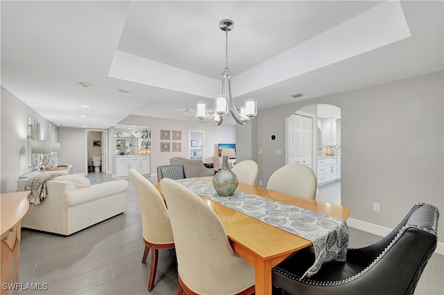 dining space with a notable chandelier