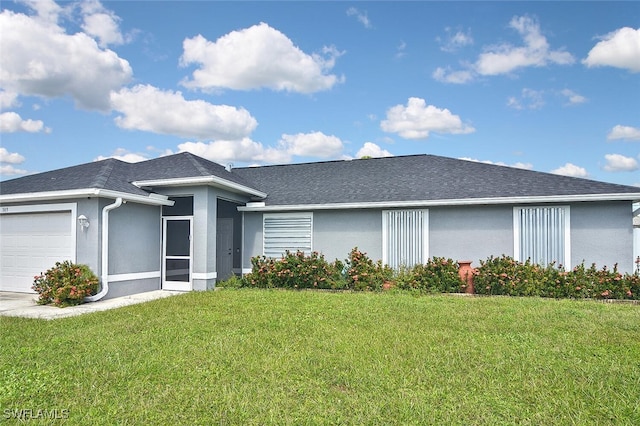 single story home with a front yard and a garage