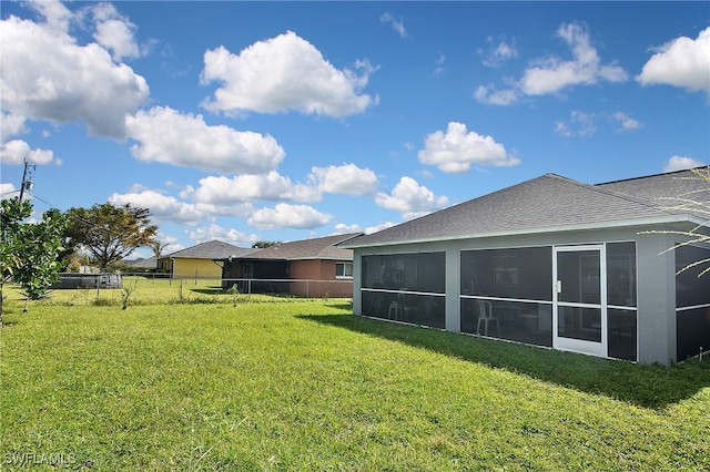 view of yard featuring a sunroom