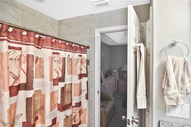 bathroom with a shower with shower curtain