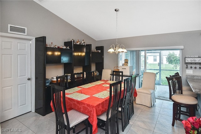 dining room with an inviting chandelier, high vaulted ceiling, and light tile patterned floors