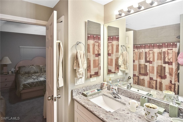 bathroom with vanity and curtained shower