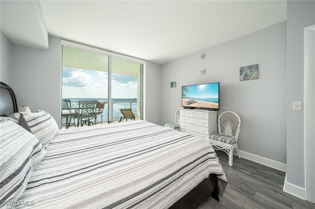 bedroom featuring access to exterior and wood-type flooring