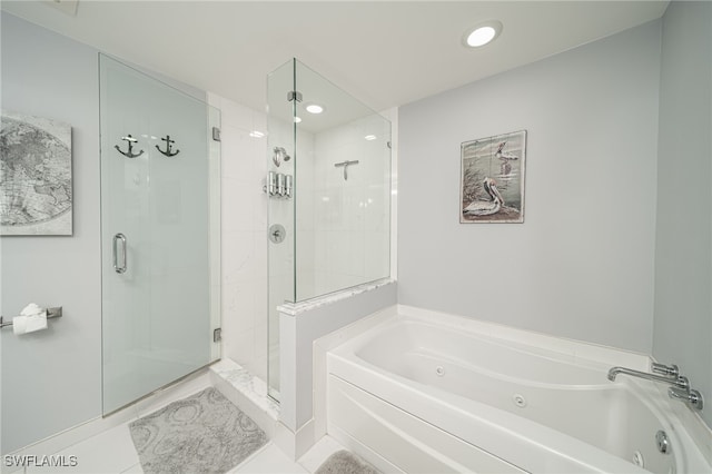 bathroom with plus walk in shower and tile patterned flooring