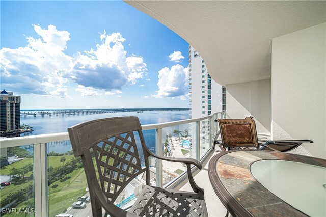 balcony featuring a water view