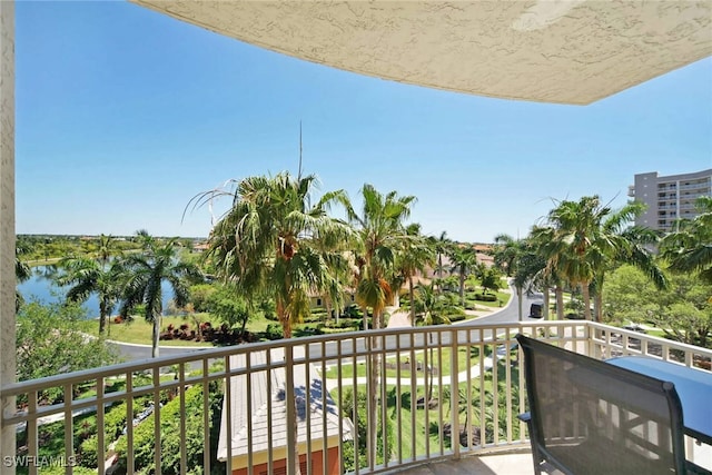 balcony featuring a water view