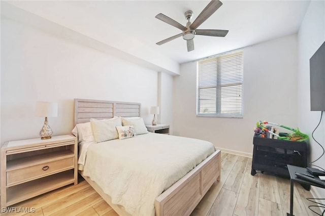 bedroom featuring light hardwood / wood-style floors and ceiling fan