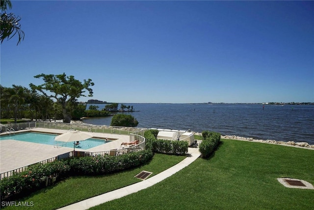 exterior space with a water view and a yard