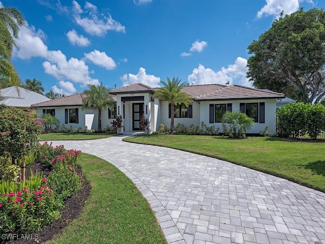 view of front of property with a front lawn