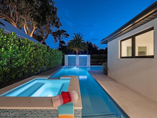 view of pool featuring an in ground hot tub