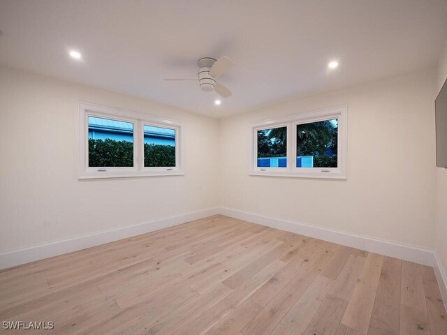 spare room with ceiling fan and light hardwood / wood-style flooring