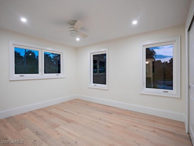 unfurnished room with light hardwood / wood-style floors and ceiling fan