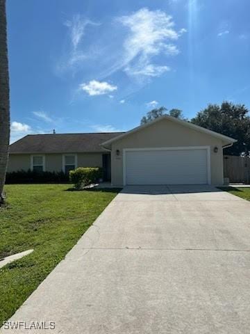 single story home with an attached garage, stucco siding, driveway, and a front yard