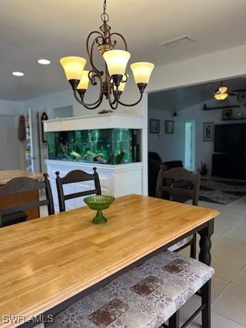 dining room with tile patterned flooring, visible vents, a notable chandelier, and recessed lighting