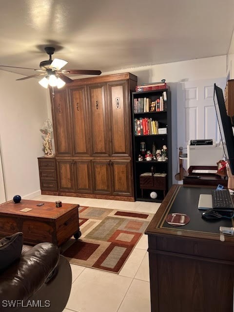 living room featuring light tile patterned floors and a ceiling fan