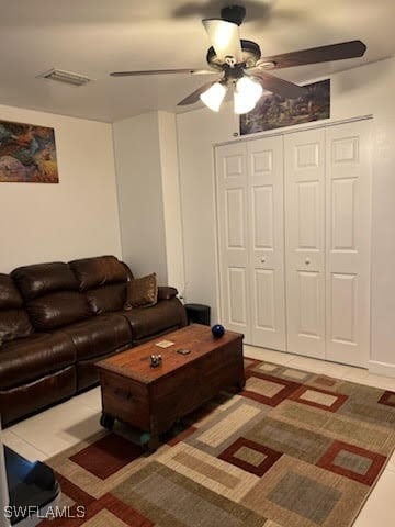 living room featuring visible vents and a ceiling fan