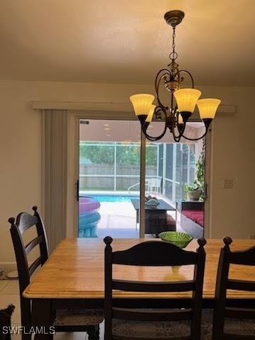 dining space featuring a chandelier