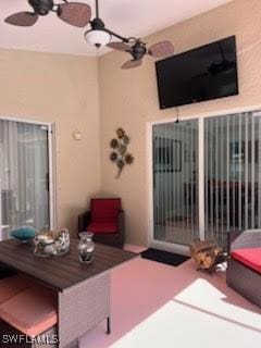 view of patio featuring ceiling fan