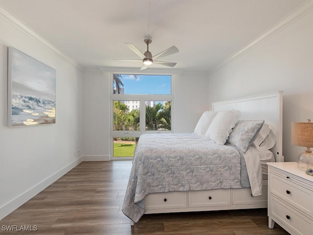 bedroom with crown molding, dark hardwood / wood-style flooring, and ceiling fan