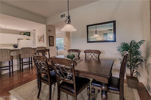 dining room with wood finished floors and visible vents