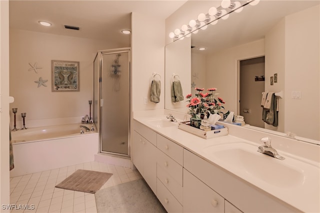 bathroom with vanity, tile patterned floors, and shower with separate bathtub