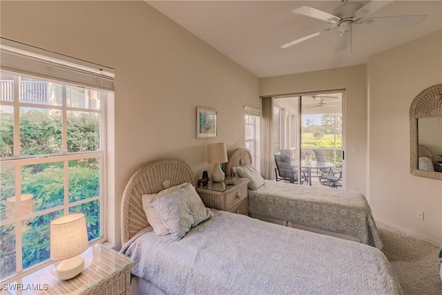 bedroom featuring ceiling fan, baseboards, lofted ceiling, carpet flooring, and access to exterior