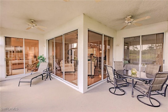 view of patio featuring outdoor dining area and ceiling fan